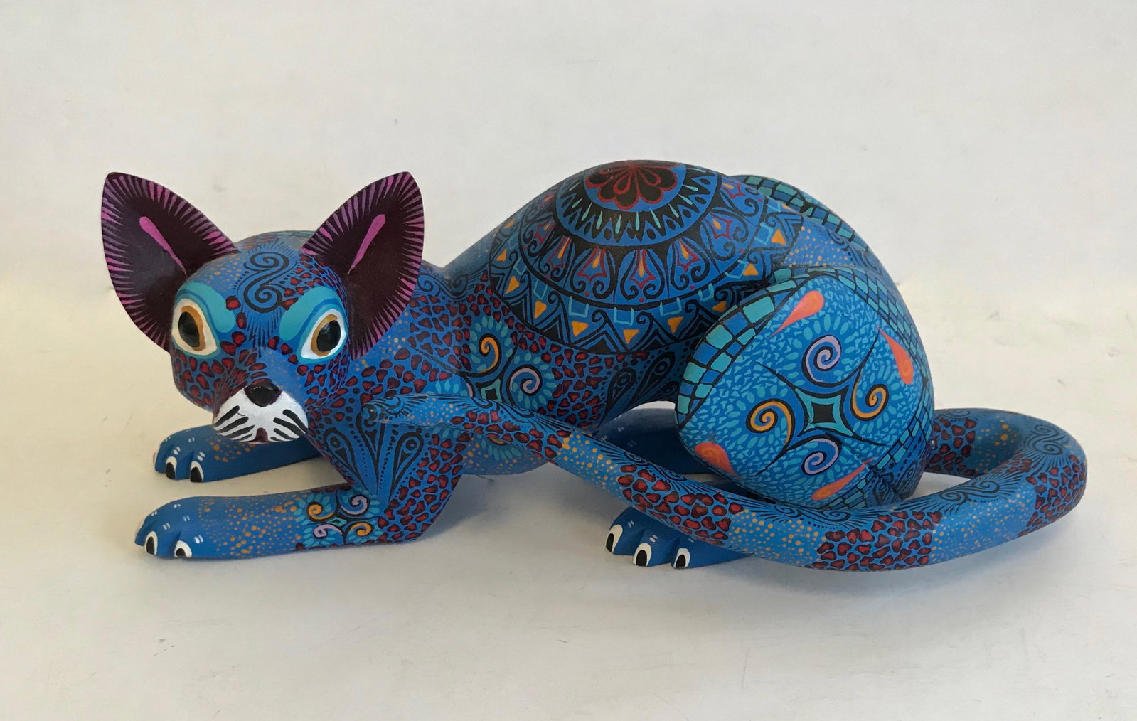 Mario & Reina Castellano Oaxacan Alebrijes Carving FOX: Mario & Reina Castellanos Oaxacan, Mexico, hand-carved and painted, BLUE FOX. Carved from a solid piece of copal wood. Signed on underside by the master woodcarvers, Mario Castellanos and Reina Gonzal