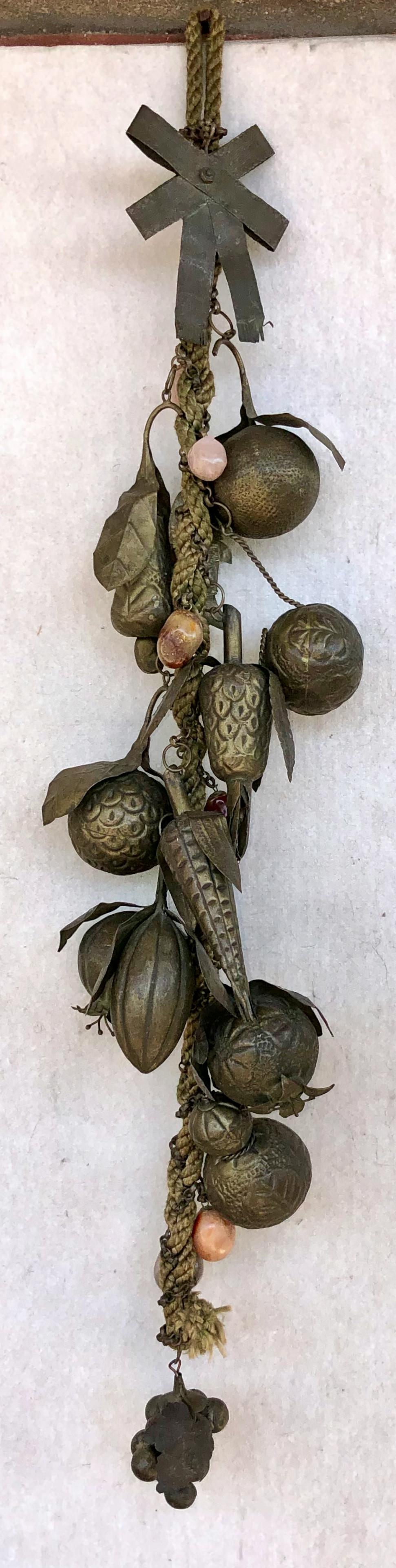 Antique Penca De Balangandan Afro-Brazilian Amulets: Antique Afro-Brazilian Penca De Balangandan. Consists of a long braided rope with 7 stones, 12 brass form of pomegranates, pears, squash, corn, grapes, pineapple, fish and vessel. Amulets depicted pla