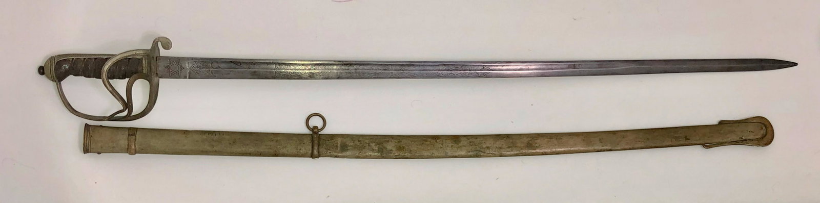 British Royal Artillery Officer's Sword with Scabbard: Antique 19th century Royal Artillery Officer's Sword with Scabbard. Blade marked Royal Artillery with embossed cyper of the British Crown. Blade is etched with scrolling arabesques on both sides. Six-