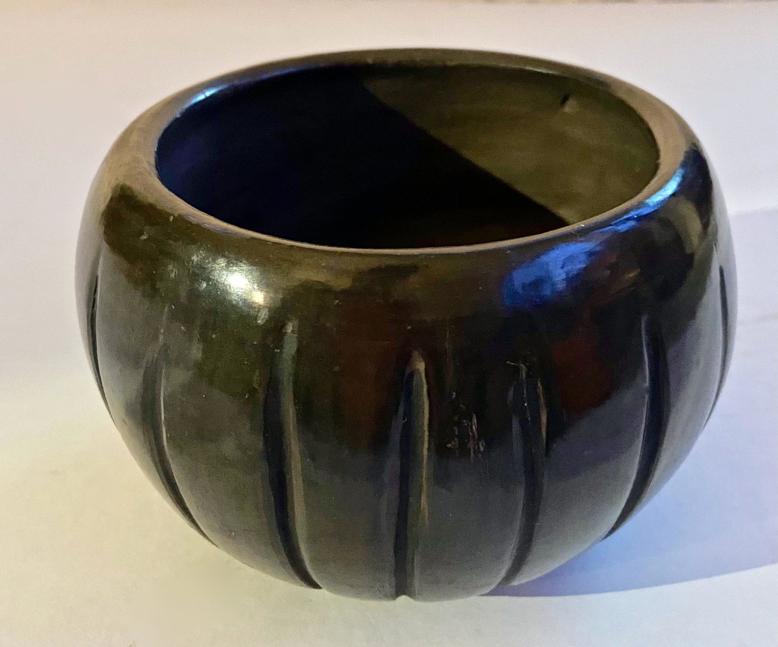 Tafoya, Pasqualita (1883-1959) Santa Clara Pueblo Bowl: Pasqualita Tafoya Santa Clara Pueblo Black-on-Black Pottery Bowl. Signed on underside: Pasqualita Tafoya, Santa Clara Pueblo. Globular form with carved designs throughout. Approximate dimensions: Heig