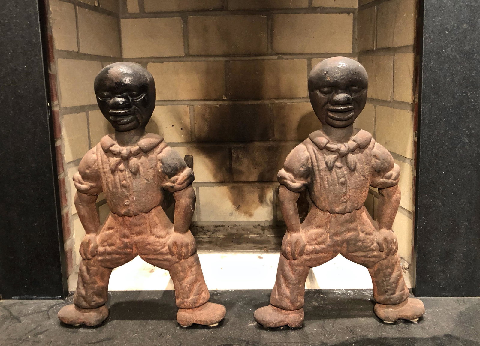 Black Americana Figural Andirons ca. 1870: Antique Pair of American Cast Iron Figural Andirons. African-American sailors in standing pose wearing shirt with bow and rolled sleeves. Original removable log support. Dimensions: height: 20 in., wi