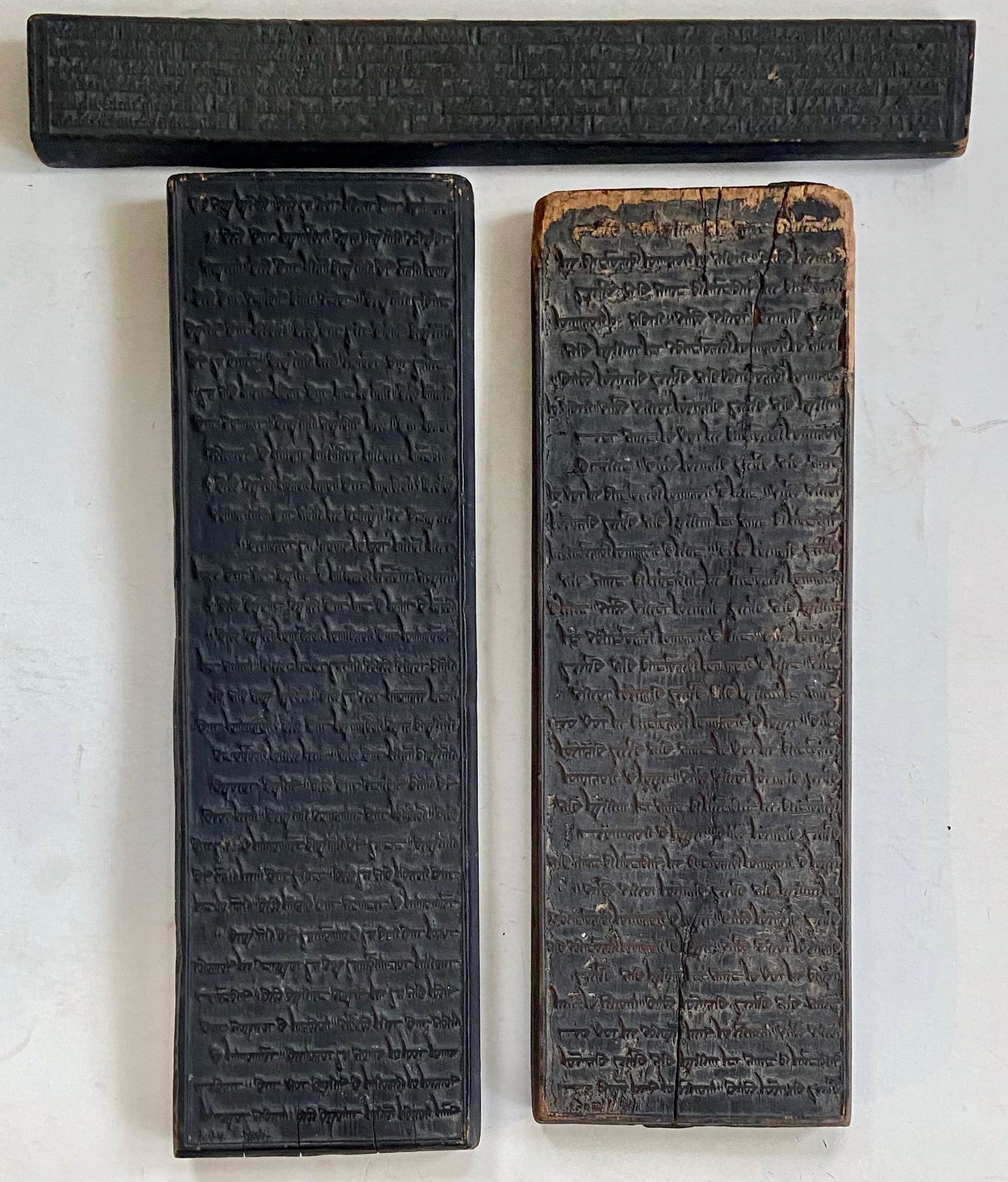 Antique Carved Islamic Prayer Boards W/ Scriptures From The Quran: Antique Islamic prayer boards carved on both sides with scripture from the Quran. Handwritten scripture in Arabic on three carved wood panels. Dimensions: top long panel: 19 1/8 in. x 2 5/8 in.; 20 in