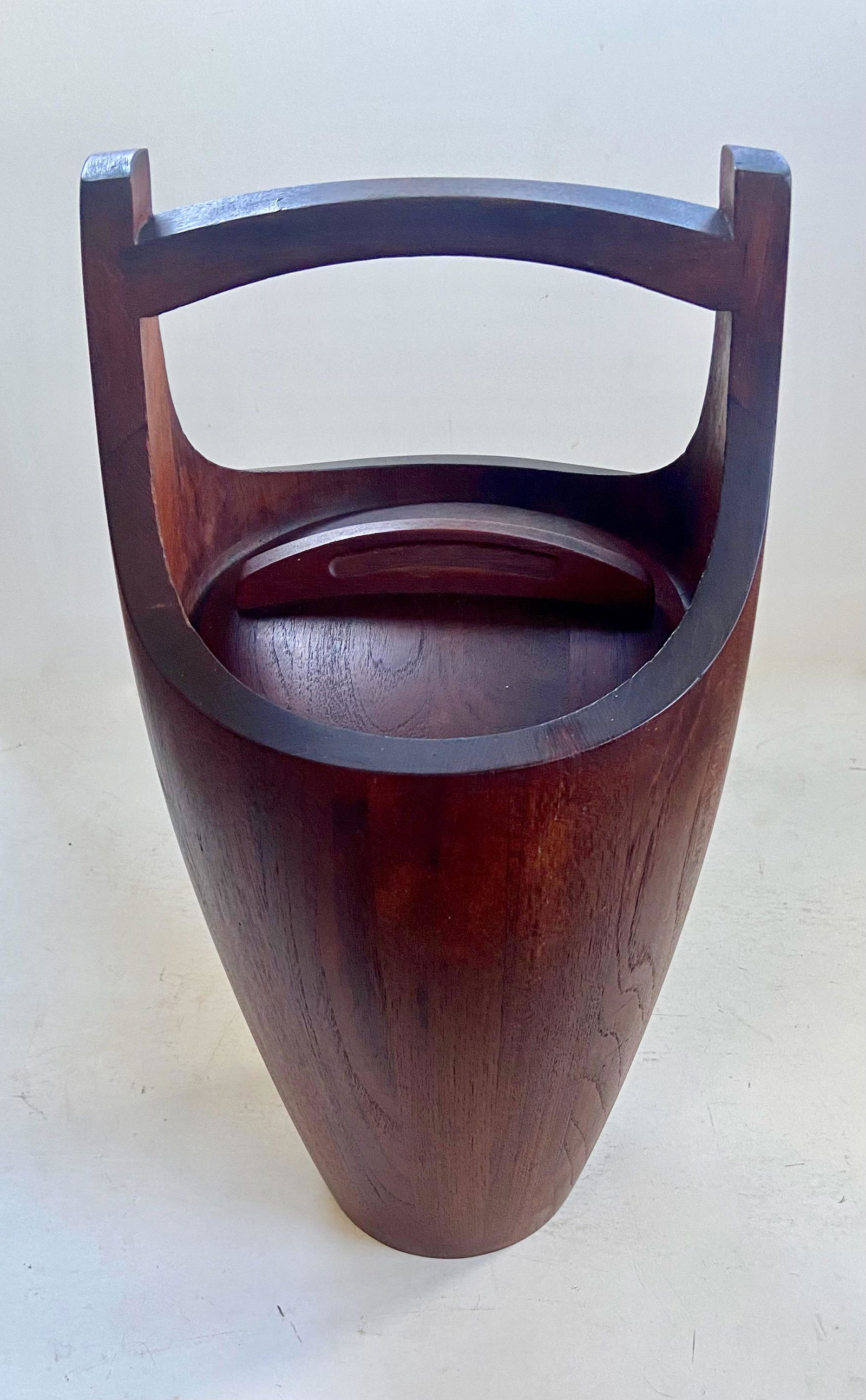 Mid-Century Large Teak Ice Bucket, Jens Quistgaard For Dansk Designs: Iconic staved teak wood Congo ice bucket designed by Jens Harald Quistgaard for Dansk Designs, 1960s. Jens Harald Quistgaard (Copenhagen, 1919-2009). Large size with orange red interior liner. Etched