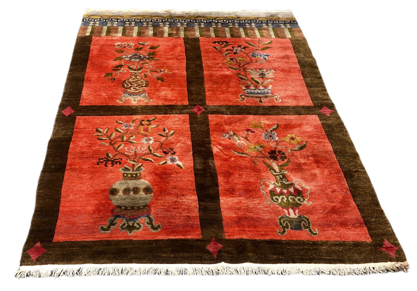 Semi-Antique Tibetan Hand-Knotted Rug, 9 ft. x 6 ft.: Estate Tibetan Hand-Knotted Wool Rug. Features four urns with exotic flowers. Wool with natural dyes. Dimensions: 9 feet x 6 feet. Condition: good pre-owned original age appropriate estate condition, 