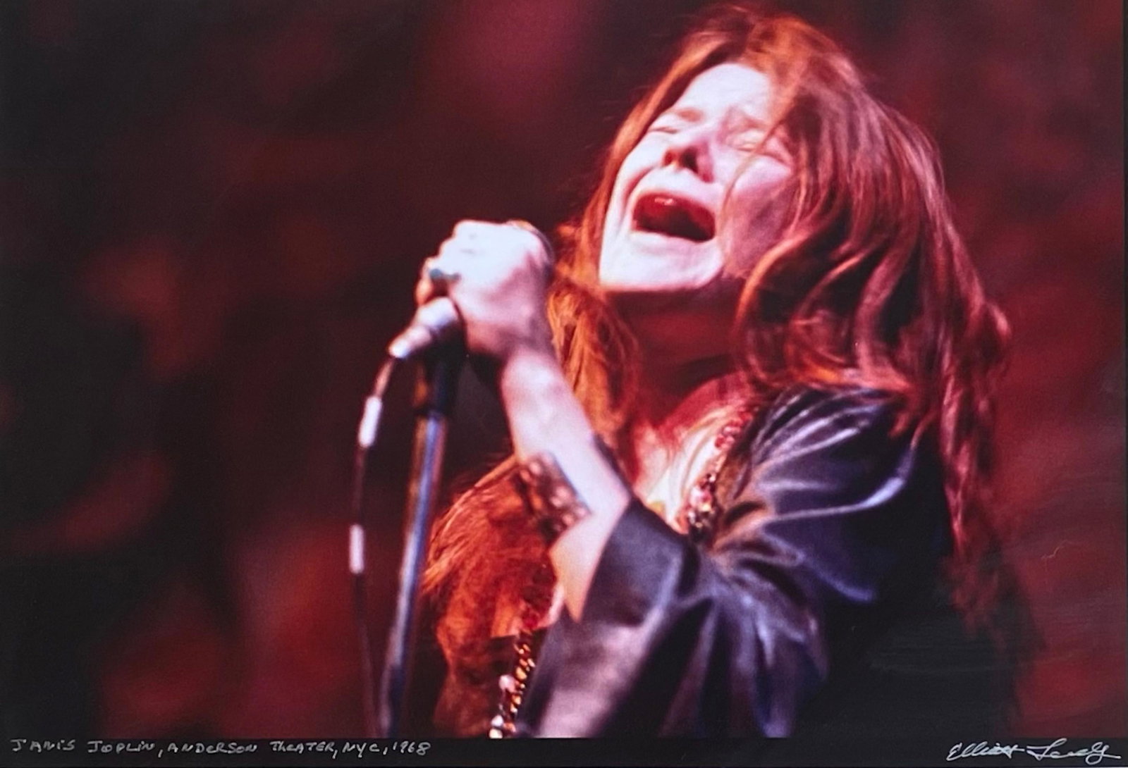 Elliot Landy Signed Photograph of Janis Joplin's N.Y.C Debut, 1968: Original Published Photograph Signed and Inscribed by the Photographer Elliot Landy. Image of Janis Joplin's N.Y.C. debut at The Anderson Theater, New York City, 1968. Janis Joplin (American, 1943-197