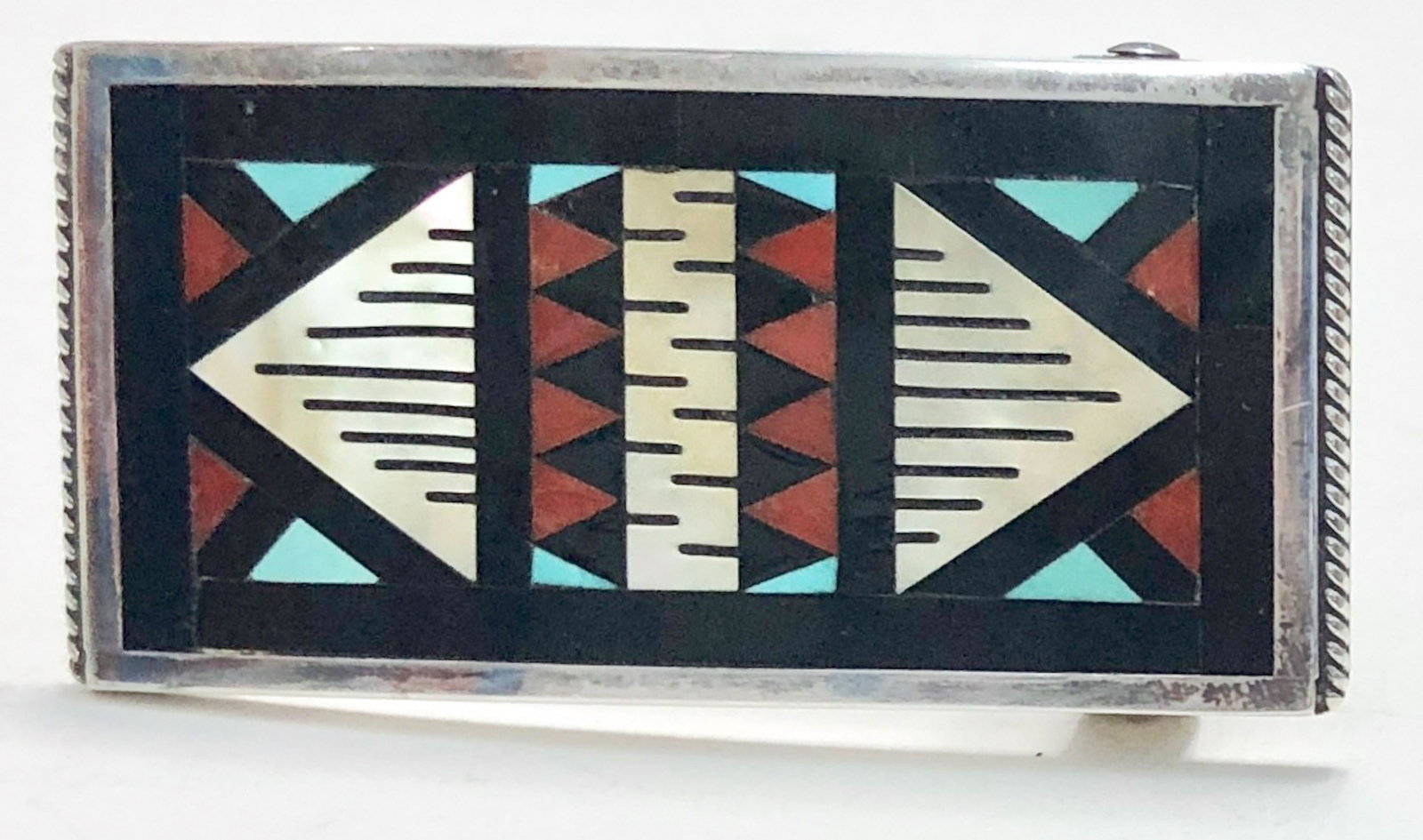 Zuni Mult-Stone Geometrical Inlay Sterling Silver Belt Buckle By L.L. Othole: Native American Zuni Inlay Sterling Silver Stone Mosaic Belt Buckle, handmade by silversmiths: Leander & Lisa Othole. Hand-signed Leander and Lisa Othole-Zuni, N.M. along with a hallmarked Sunface. Ap
