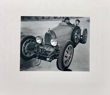 Edward Weston, (1886-1958)/ Cole Weston, (1918-2003) IVANOS And BUGATTI: Ivanos and Bugatti. Silver Print, Monochrome Image of Paul Ivanos with Actress Claudette Colbert in the Type 35 Bugatti. Negative by Edward Weston; Print by Cole Weston. Cole Weston was Edward Weston'