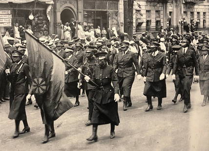 Black Nationalist Women Marching In Harlem, Photograph, N.Y.C.1924: Black Nationalist Women and The Global Struggle For Freedom. UNIA March-Universal Negro Improvement Association. Uniformed Black Nationalist Women during a Marcus Garvey Rally Marching on Seventh Ave.