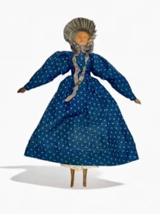 19th C. American Folk Art Carved Wood Jointed Doll: 15 inches: 19th Century American Folk Art Carved Wood Jointed Doll. Head and torso carved from a single piece of wood with peg jointed arms and legs. Dressed, wearing silk ribbon bonnet, printed blue calico cott