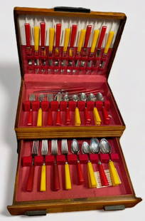 1930s Butterscotch & Red Bakelite Flatware Housed In Wood Chest (58): 1930s Vintage Red and Butterscotch Bakelite Handled Flatware. 58 pieces. Housed in a 3 Tiered Wood Chest. Includes: SAME PATTERN. 6-Butterscotch dinner forks. 3-Red dinner forks. 6-Red teaspoons. 6-Bu
