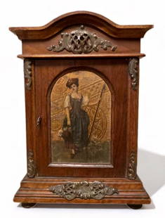 19th C. Miniature Jewelry Chest Armoire w/ Painting, Germany ca. 1870s: 19th Century Gold Embossed Beautiful Miniature Walnut Jewelry Chest Armoire. Carved walnut, bronze mounted footed chest. Gold embossed panel with painting of a beautiful girl holding a basket of flowe