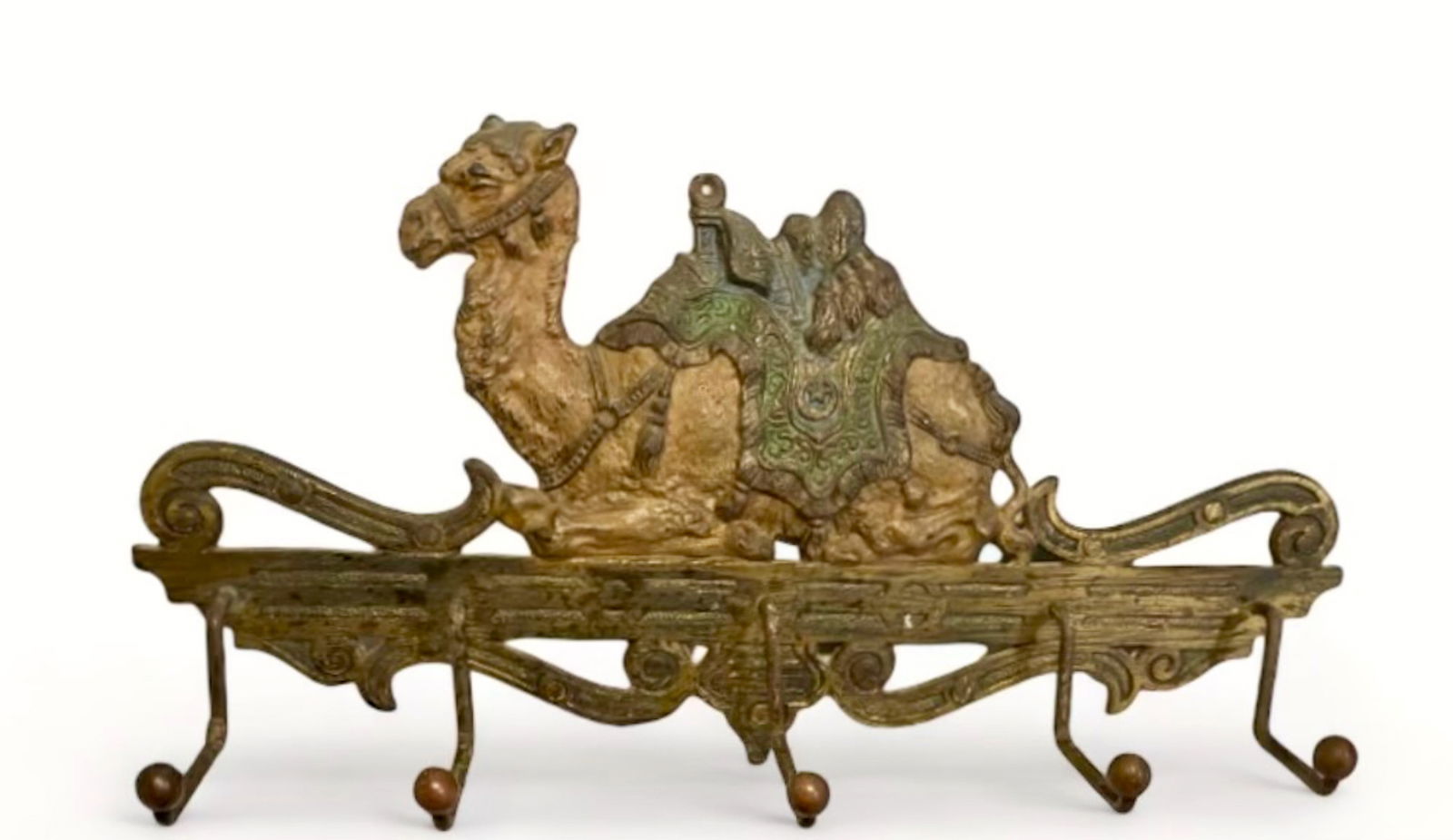 Antique Judd Cast Iron Cold-Painted Camel Wall Hook Rack: Figural Recumbent Camel. American cold painted cast iron camel wall hook rack. C.J.O. Judd Manufacturer (New Britain, Company). Recumbent Desert Camel rack holder with 5 hooks, for keys, leash, coats