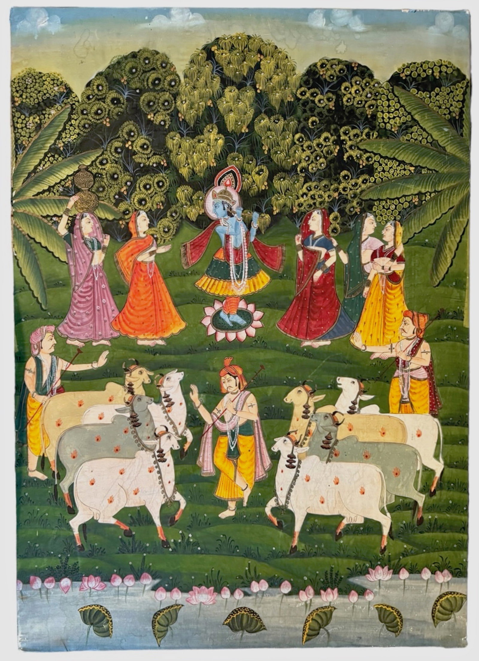 Pichhavai Painting Of Krishna w/ Female Gopis, 1960s: Pichhavai Painting of Krishna Playing His Flute, Surrounded by Gopis. Image of Krishna playing his flute on a bed of lotus with animals and Gopis surrounded by a lush forest. Gouache on cotton, mounte