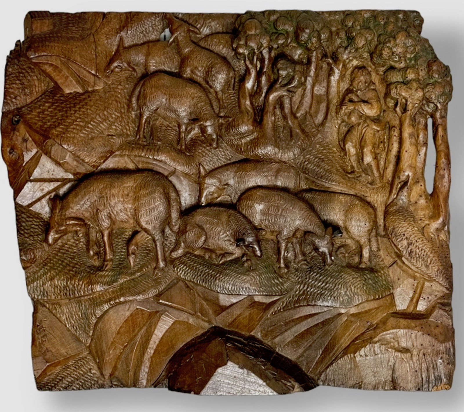 Antique European Hand Carved Wood Wall Plaque, 19 1/2 " x 17 1/2": European Antique wood wall plaque hand-carved in high relief. Depicts animals grazing along a mountain side with a watchful figure by the trees. Carved from single piece of wood in high relief. Solid
