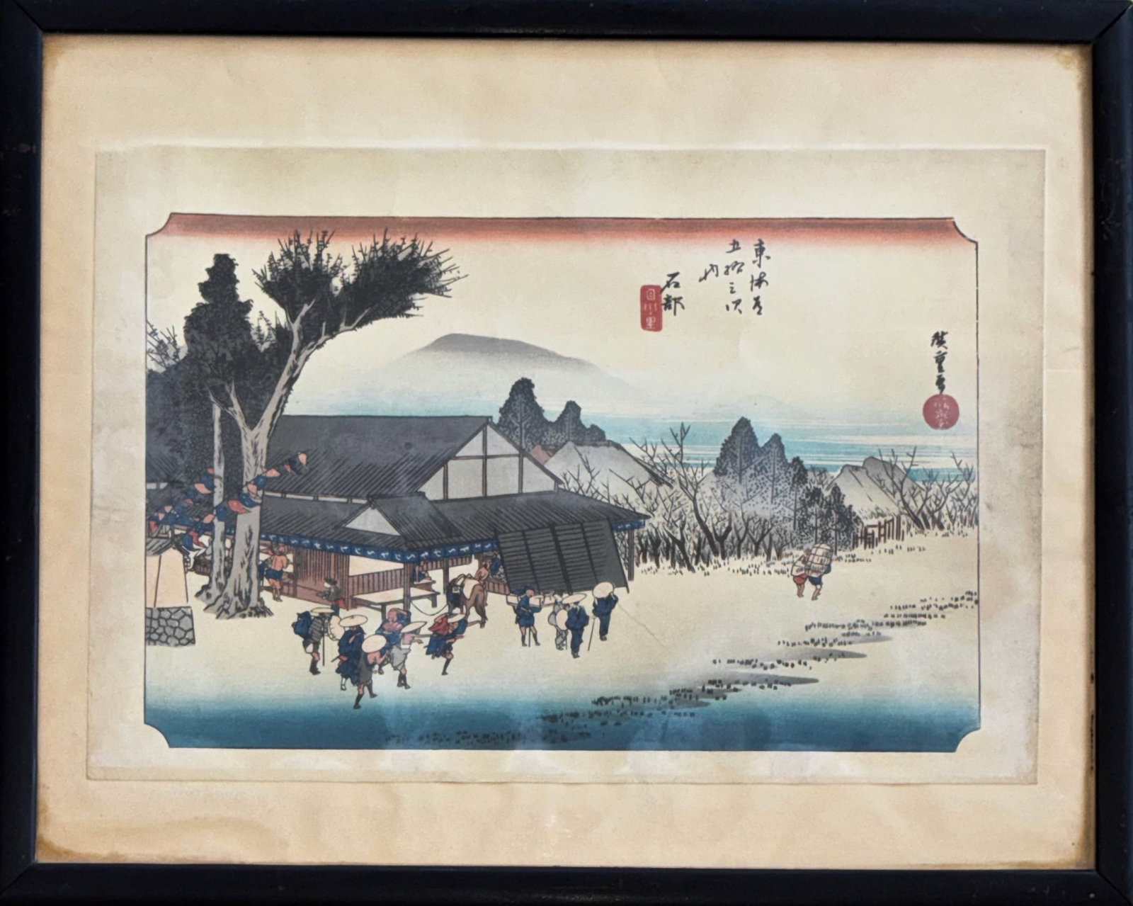 Ando Utagawa Hiroshige (Japanese, 1797-1858) Ishibe: Megawa Village c. 1833-34: FIFTY-THREE STATIONS OF THE TOKAIDO. Megawa Village near Ishibe (station #53). Ukiyo-E Woodblock Print. Publisher: Takenouchi Magohachi. Ink and color on paper. Dimensions: Framed: 14 1/2 x 18 inches.