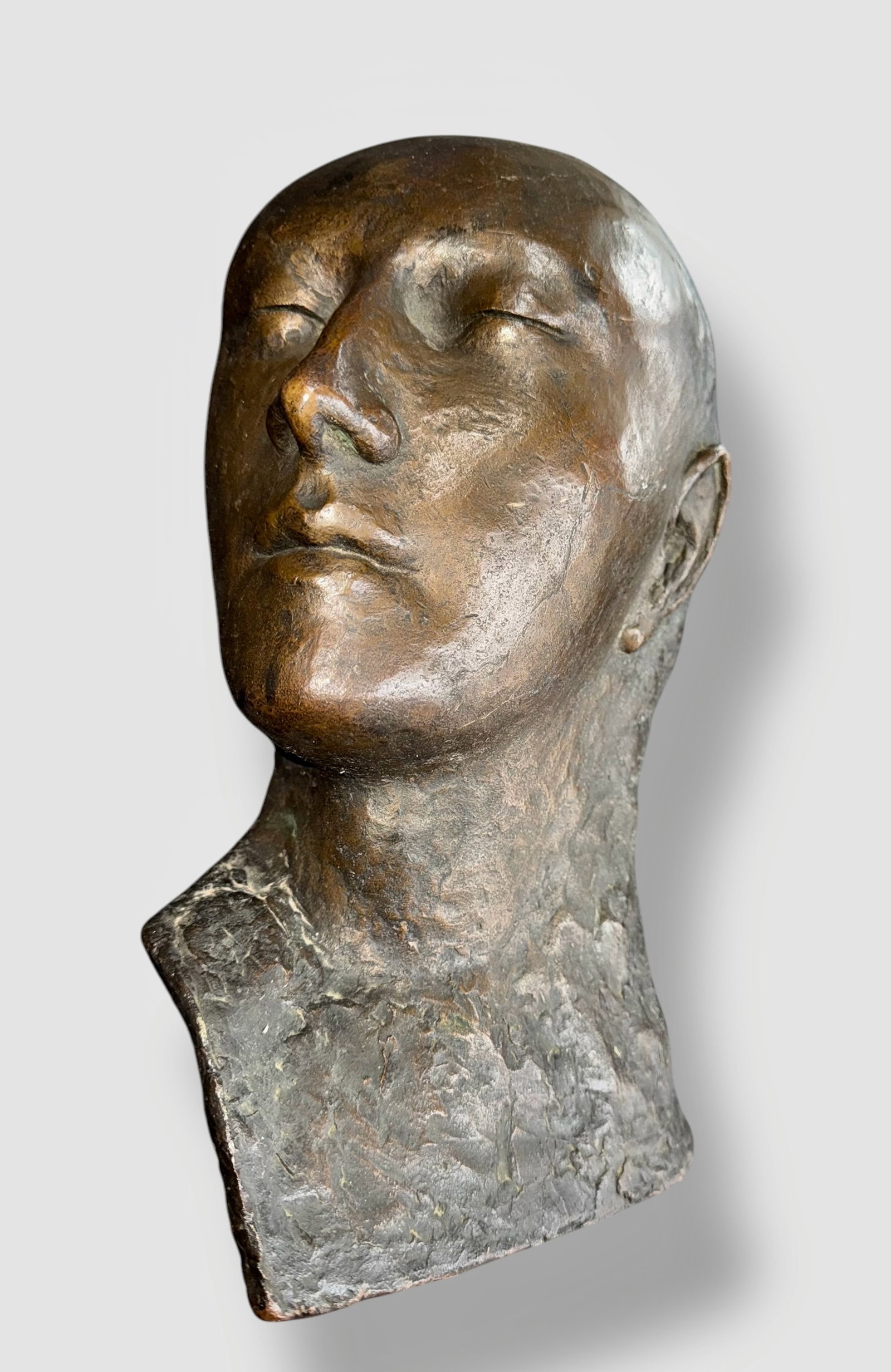 Bronze Sculpture PROFILE OF A MAN ca. 1920s: Bronze bust of a man. Circa 1920s. Solid bronze approximately 16-18 pounds. Dimensions: 12 1/2 x 9 x 4 1/4 inches. Possibly an architectural wall sculpture (view back). Condition: good original pre-ow