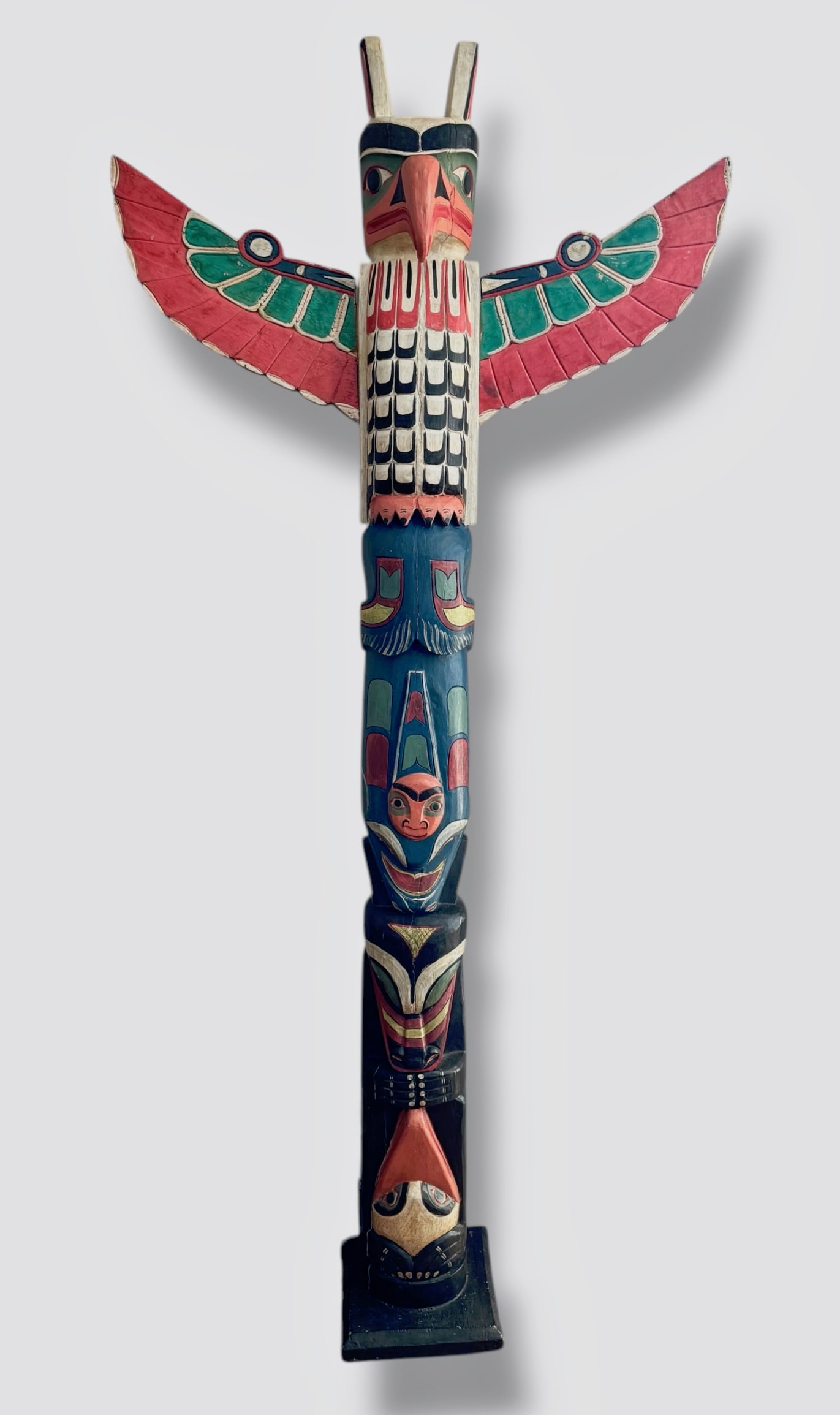 Large Northwest Coast Carved & Painted Raven Totem Pole: 6ft. 5in.: Large First Nation Northwest Coast Hand-Carved and Painted Raven Totem Pole with Outstretched Wings. Circa 1960. Carved from a single piece of wood, wings are solid and can be removed. Dimensions: 6 f