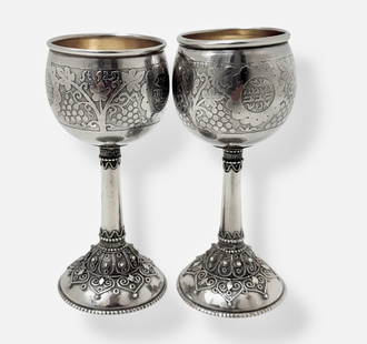 Judaica: Pair of Sterling Silver Kiddush Cups: Pair of Sterling Silver Kiddush Cups, adorned with etched designs and applied silver balls surrounded by wirework.Marked: St.925 (view photo).Within the acid etched design are words of the Hebrew