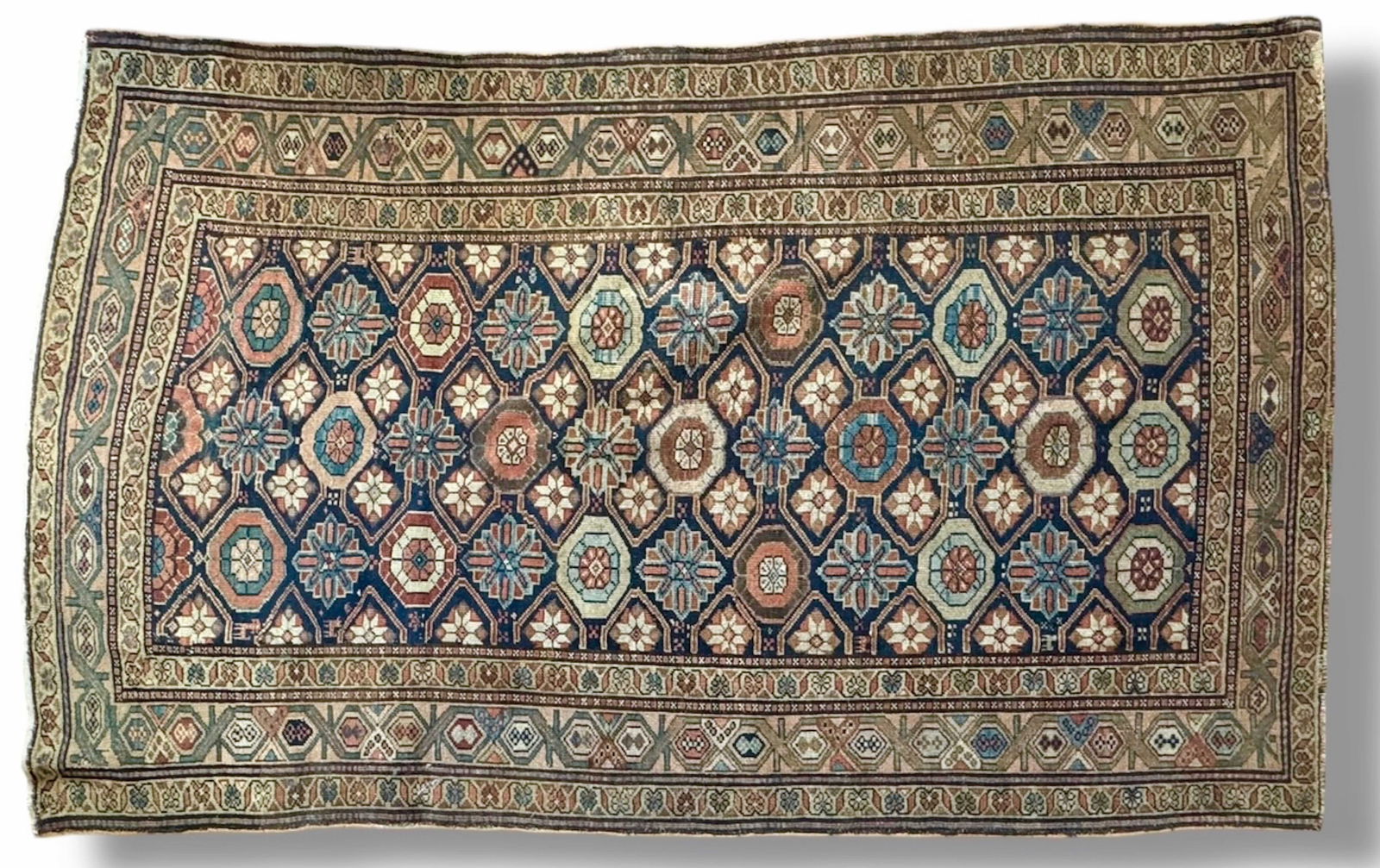 Antique Persian Kurd Rug, ca. 1920s, 7' 25" x 4' 5": Estate Persian Kurd Rug. Handwoven with soft wool pile. Circa 1920s. Geometric patterns throughout. Dimensions approximately: 7' 25" x 4' 5" (87 x 53 inches). Condition: good overall pre-owned estate