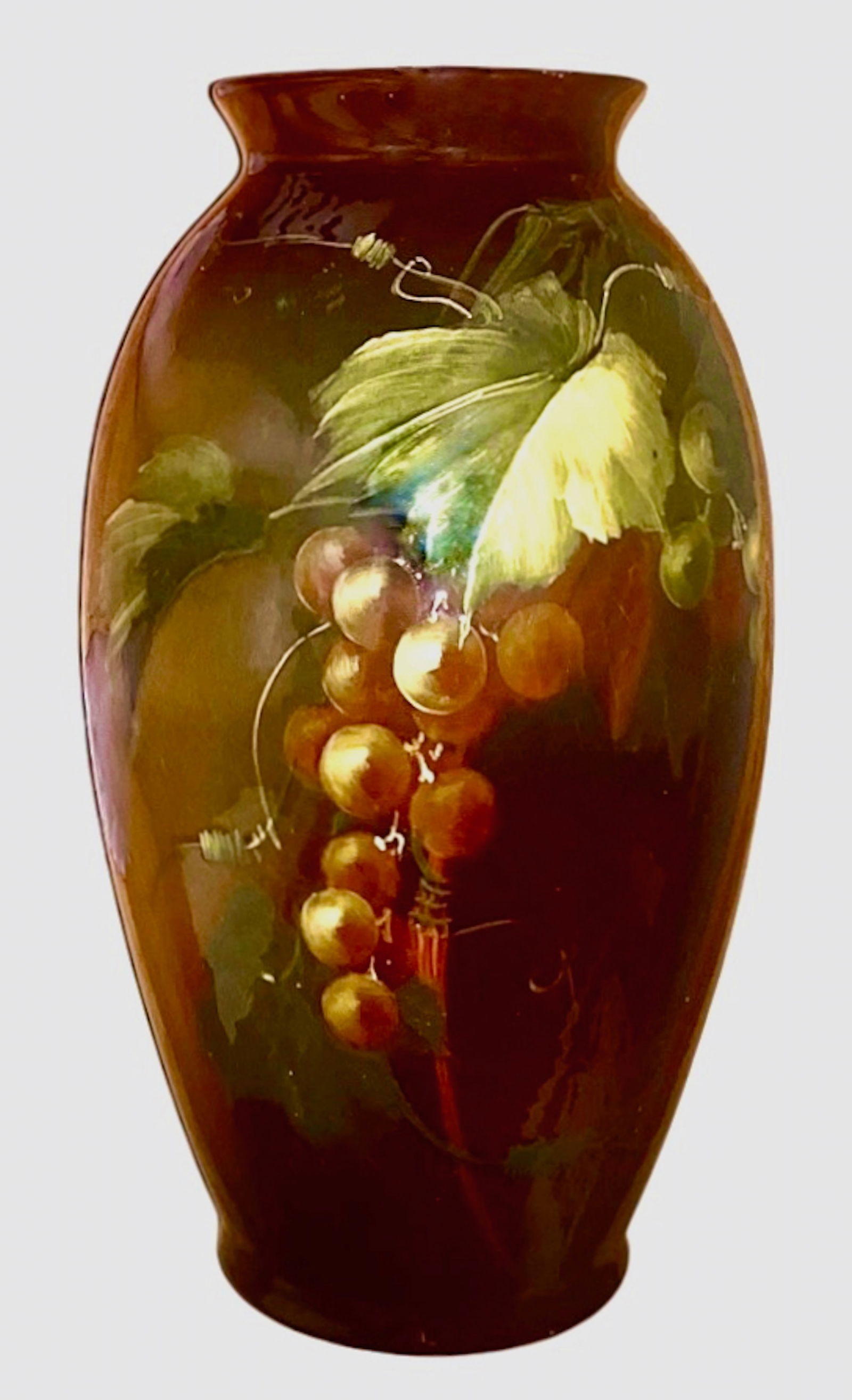 Rozane Royal Ware Art Pottery Vase From The Roseville Pottery Co., Ohio, c. 1900s: Large Rozane Ware Roseville Art Pottery, Signed. Early 1900s. Decorated with cluster of grapes, vines and leaves underglaze slip painted design. Embossed on the underside with Rozane Ware Wafer Seal (