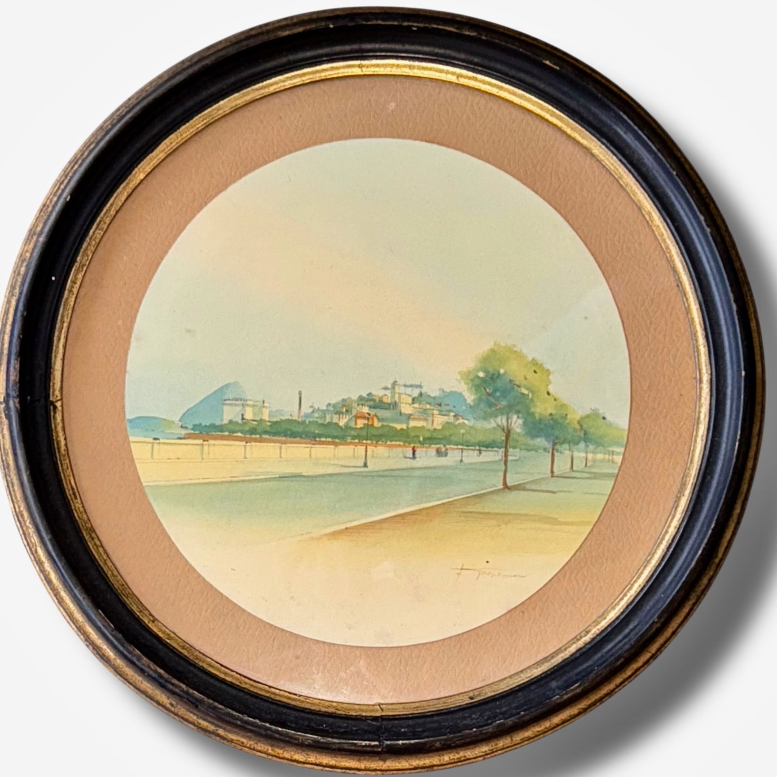 Henrique Goldschmidt (Brazilian, 1867-1952) Coastal Landscape, Rio de Janiero: Rio de Janiero coastal watercolor, signed by the artist Henrique Goldschmidt (lower right). Watercolor on paper. Housed in a custom circular wood frame under glass. Diameter Dimensions: framed: 12".,