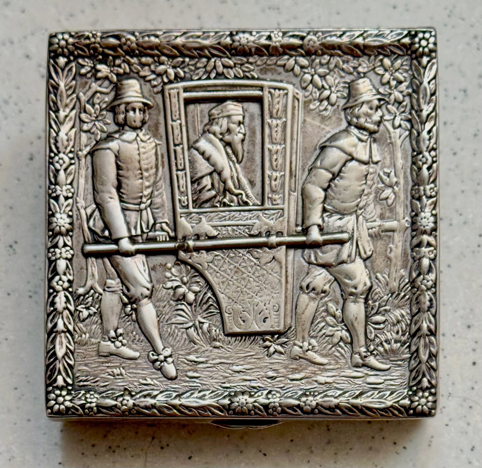 Antique Dutch Silver Snuff / Tobacco Repousse Box- Inscribed & Dated 1913: Antique Dutch silver snuff / tobacco presentation box. Features a high-relief repousse hinged lid depicting a Royal figure seated inside a carriage accompanied by footmen. On reverse: Hand-engraved Ed