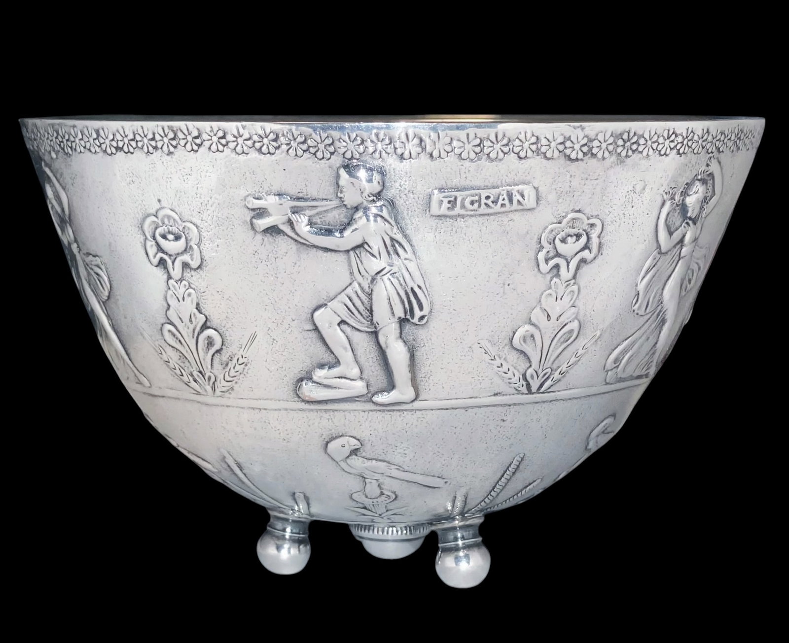 Antique Greco-Roman Revival Silver-Plate Bowl by E. F. Caldwell, New York: Gilded Age "Archeological Revival". Turn of the century, silver-plated repousse footed bowl, by E. F. Caldwell, New York. Repousse adorns the outside with dancing nymphs, musicians, flora and birds. C