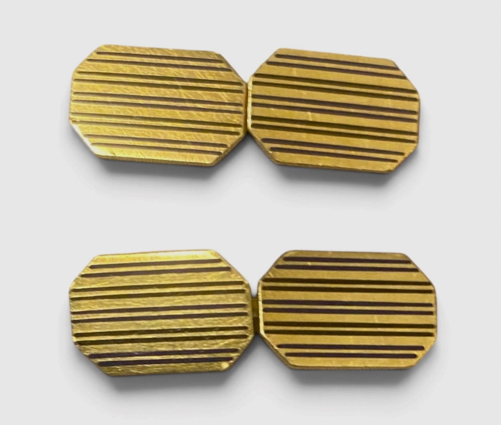Art Deco 14k Gold Enameled Pinstriped Panel Cufflink Set By Carrington & Company: Carrington & Company 14k yellow gold art deco era cufflink set with a finely engraved black enameled pinstripe octagon panel design. Dual-Hallmarked cufflink set: 14k with A C mark for the artisan Art