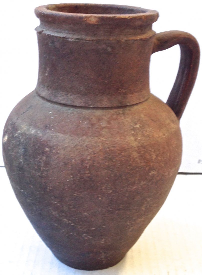 Native American Clay Handle Vessel Urn, 9.7"hgt.: American Clay Vessel Urn, 9.7"hgt. Native American handled clay pottery vessel Iroquoian Tribe: Haudenosaunee Color: Dark clay Dimension: 9.7 hgt x 8" wd * Similar vessels can be viewed at Seneca-Iroq