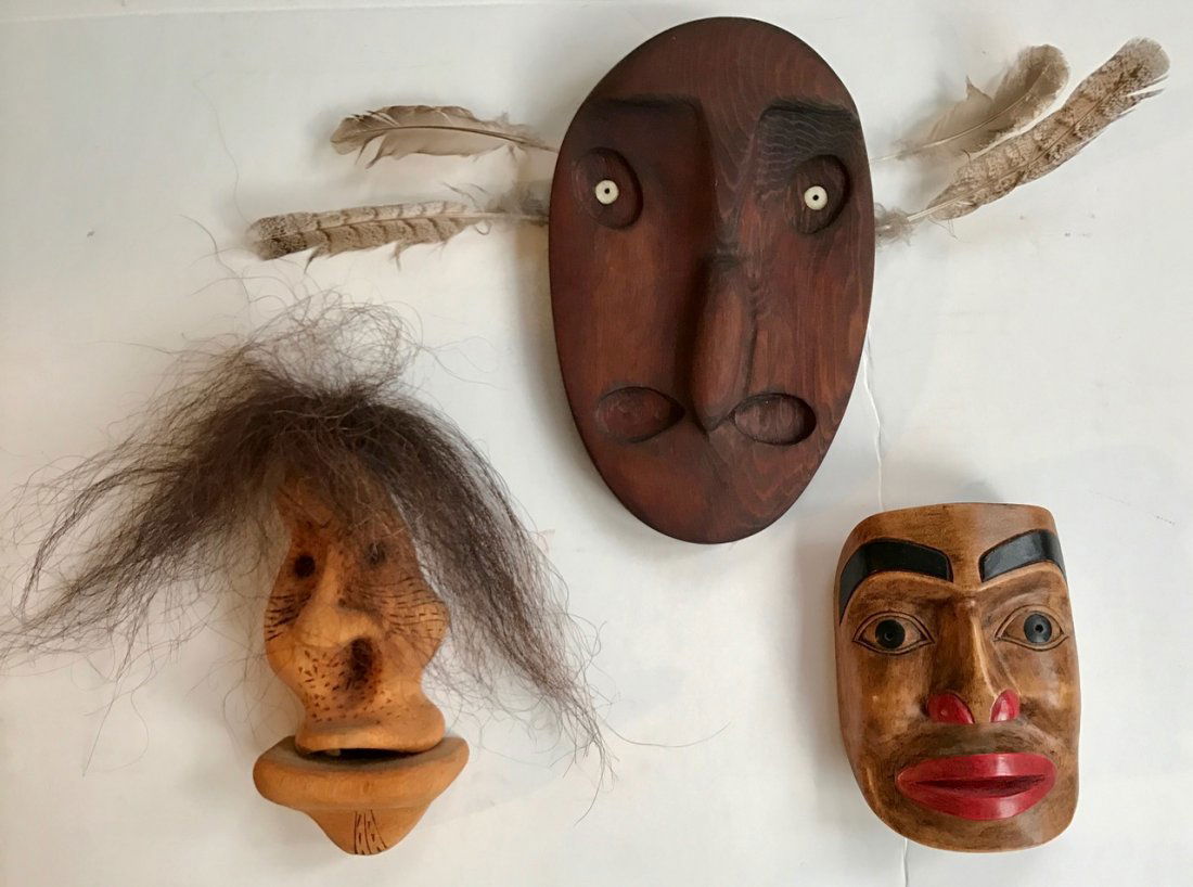 Eskimo / Inuit Carved Masks, Signed (3): Three signed Eskimo carved wood masks. 1-Woodcarver: Peter Lind, Jr. (Alaska) carved signed mask. Dimension: 8.50"x 5.50". 2-Woodcarver: Artie George ( North Vancouver, Tsleil-Waututh Nation) carved p