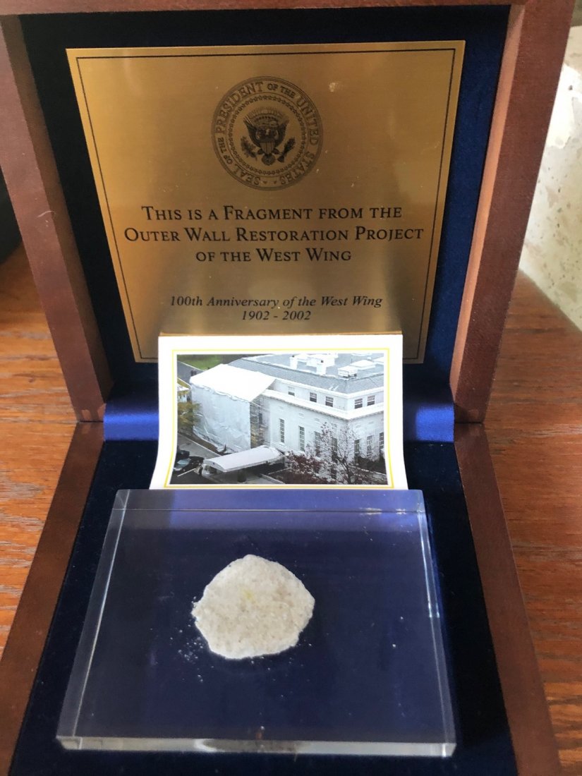 Fragment of Outer Wall in West Wing: This is a fragment from the outer wall restoration project of the West Wing. 100th Anniversary of the West Wing 1902-2002. The fragment measures 1.5x1.25 and is encapsulated in a 4x3 container. Comes 