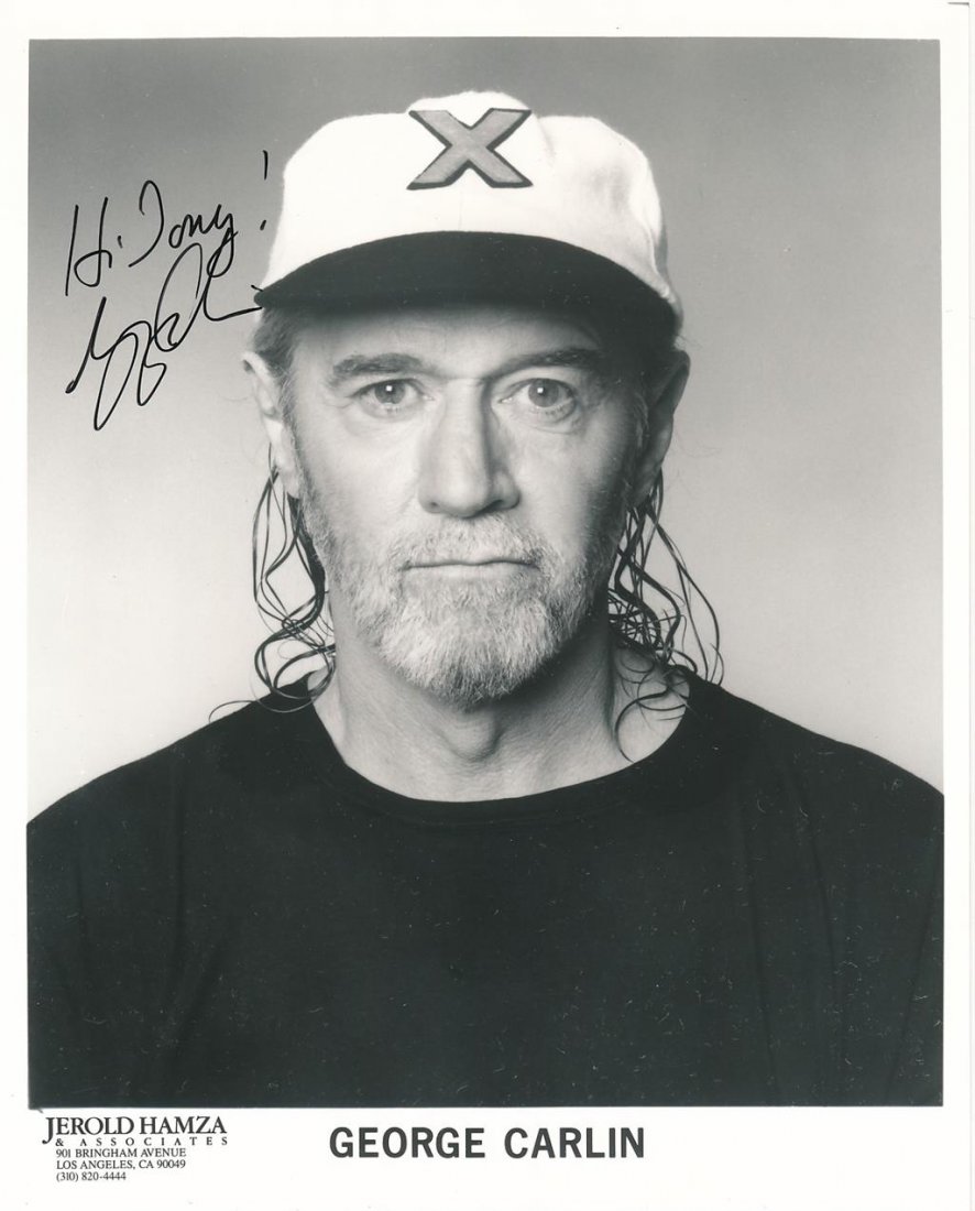 George Carlin-Signed Photograph: 8X10 B&W Glossy management photograph signed and inscribed in black felt tip ink to Tony by George Carlin. In very good condition.Comes with a full Letter of Authenticity from Todd Mueller Authentics.