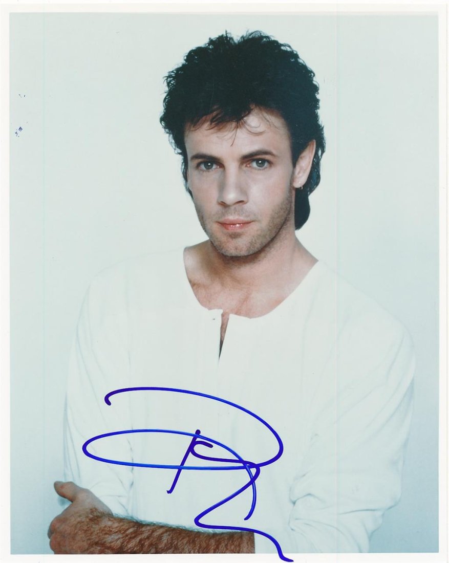 Rick Springfield- Signed Color Photograph: 8X10 Color Glossy photograph signed in blue felt tip ink nicely by Rick Springfield. In very good condition. Comes with a Letter of Authenticity from www.ToddMuellerAuthentics.com.
