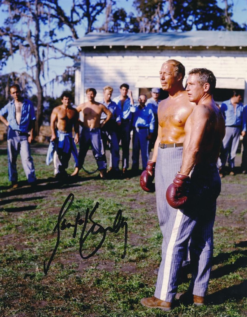 George Kennedy- "Cool Hand Luke" Signed Photograph: 8X10 Color Glossy photograph from, "Cool Hand Luke," signed in black felt tip ink by George Kennedy. In very good condition.Comes with a Letter of Authenticity from www.ToddMuellerAuthentics.com.