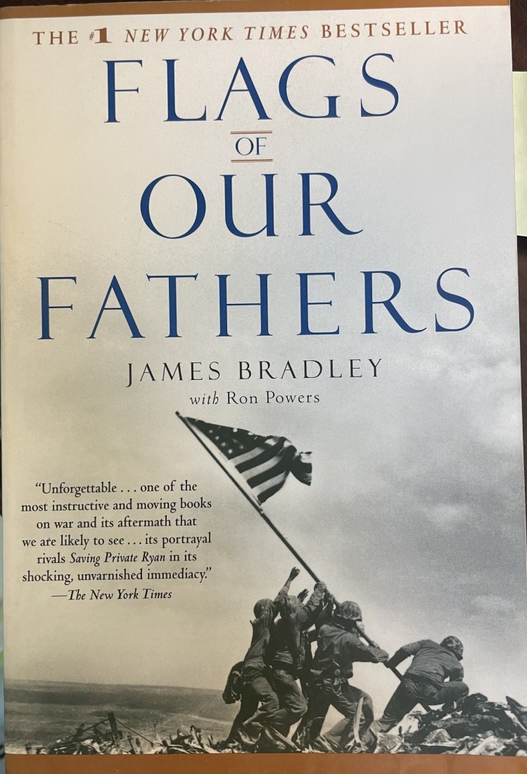 Charles Lindberg- Signed Softcover Book; "Flags of Our Fathers": Softcover book; "Flag's of Our Fathers," signed inside on the photo of Lindberg lifting up the Iwo Jima flag. Signed by Charles Lindberg on that photo. In very good condition.Comes with a full Letter 