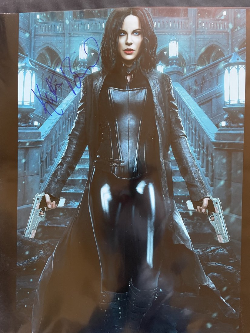 Kate Beckinsale-Signed 16x20 Photograph from "Underworld": 16x20 Color photograph from "Underworld" and signed in felt tip ink by Kate Beckinsale. In very good condition with very minor creasing on the left portion. This would look perfect matted and framed. 