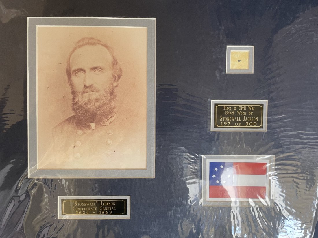 Stonewall Jackson- Piece of his Worn Civil War Scarf Matted: Limited Edition 197 of 300. Small piece of Stonewall Jackson's worn Civil War scarf matted with a photograph, two name plates to an overall size of 20X16. Comes with a COA from John Reznikoff.
