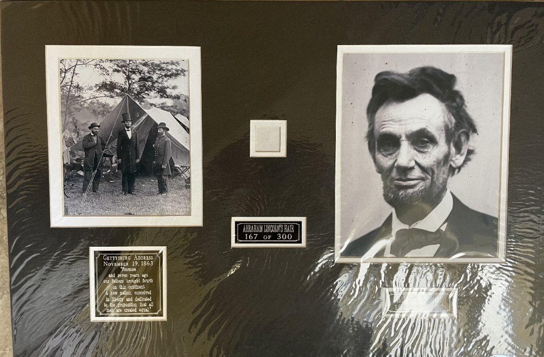 Abraham Lincoln- Strand of his Hair Matted: Limited Edition 167 of 300. Strand of Abraham Lincoln's hair matted with two photographs, three nameplates to an overall size of 24X16. Comes with a COA from John Reznikoff.