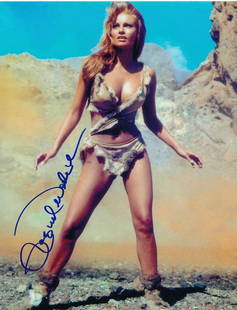 Raquel Welch Signed Photo from Private Signing "Iconic Photo!!!!!": 8x10 Color glossy photograph of Raquel Welch signed in blue felt tip ink during her exclusive private signing with Todd Mueller Authentics. www.ToddMuellerAuthentics.com.This is the iconic One