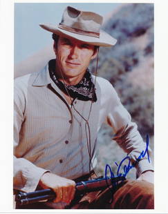 Clint Eastwood-Signed Color Photograph: 8x10 Color glossy photograph signed in blue felt tip ink by Clint Eastwood. Excellent condition. Comes with a full Letter of Authenticity from Todd Mueller Authentics.