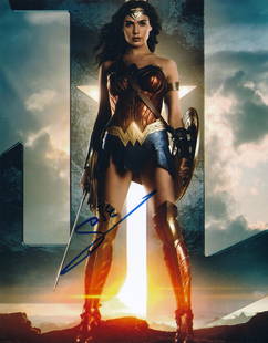 Gil Gadot-Signed Photograph "Wonder Woman": 8x10 Color satin finish photograph from "Wonder Woman" and signed in blue felt tip ink by Gil Gadot. Excellent condition. Comes with a full Letter of Authenticity from Todd Mueller Authentics.