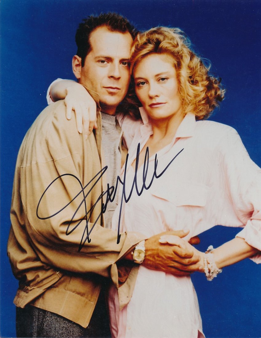 Bruce Willis-Signed Photograph from "Moonlighting": 8x10 Color glossy photograph from the T.V. Series "Moonlighting" and signed in blue felt tip inks by Bruce Willis. Excellent condition.If the lot sells for $10 or more it will come with a full Letter