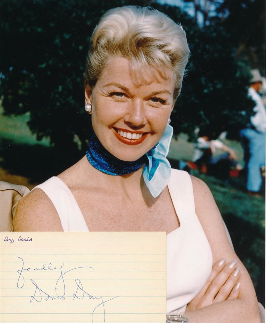 Doris Day-Signed Vintage Index Card w/Photograph: Vintage 5x3 lined index card signed in blue ballpoint ink by Doris Day. Comes with an unsigned stuning color photograph. In very good condition. Doris Day was an American actress, singer, and animal w