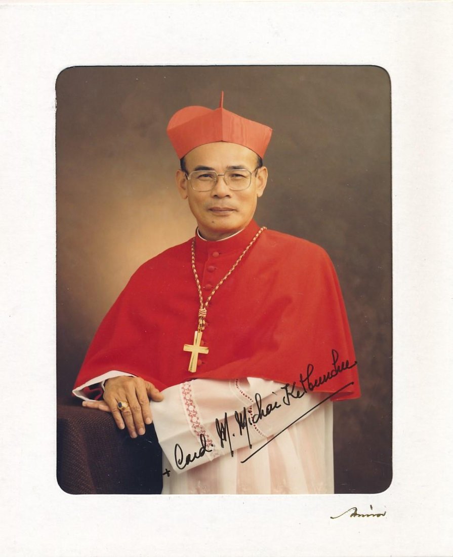 Cardinal Michael Michai Ikitbunchu (Archbishop of Bangkok Thailand)-Signed Photograph: 3.5X4.5 Color photograph signed in black felt tip ink nicely by Cardinal Michael Michai Ikitbunchu. Comes in a photo holder sent by him.Michael Michai Kitbunchu is a Thai prelate of the Roman Catholic