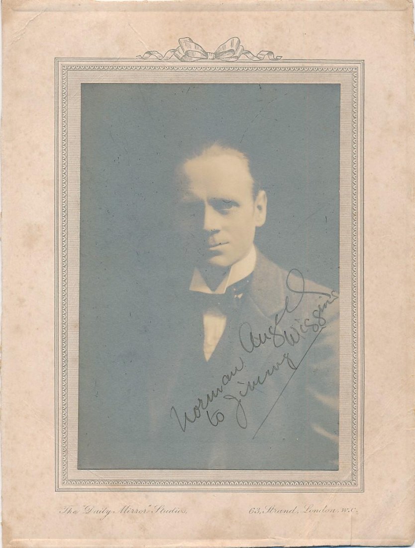 Sir Norman Angell-Rare Vintage Original Signed Portrait (Nobel Prize 1933): 6.25X8.25 Vintage sepia photograph tipped to a "The Daily Mirror Studios" presentation photograph holder. Signed on the photo in black fountain pen ink, "Norman Angell, to Jimmy Wiggins." The photogra