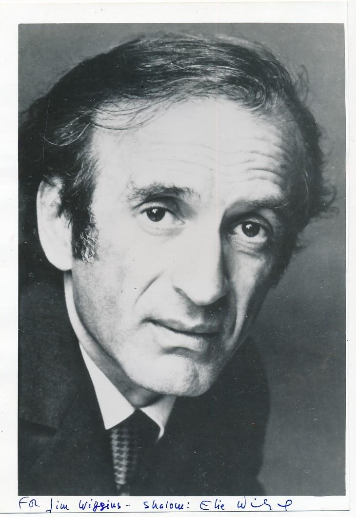 Elie Wiesel-Vintage Signed Photograph (Nobel Prize 1986 & Holocaust Survivor): 4.75X7 B&W Glossy vintage photograph signed in the lower margin in blue felt tip ink, "For Jim Wiggins- Shalom: Elie Wiesel." A light bend/crease to the middle right edge, otherwise nice.(1928-2016) E