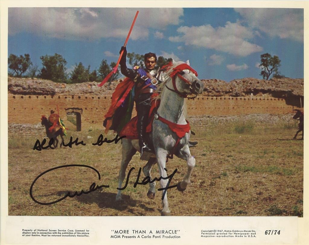 Omar Sharif- Signed Vintage Photograph from "More Than A Miracle": 10x8 Color vintage photograph from, "More Than A Miracle", signed in black felt tip ink by Omar Sharif. Some edge creasing, otherwise, in good condition. (1932-2015) Omar Sharif was an Egyptian actor,