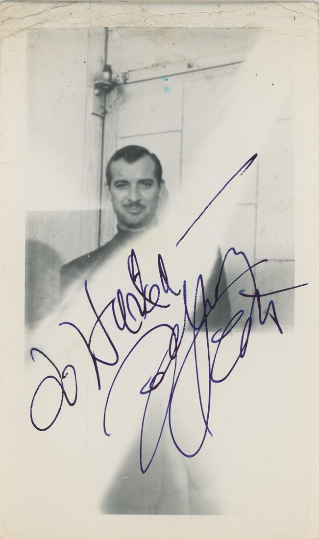 Zachary Scott-Vintage Signed Photograph: 3.5x5.75 Vintage photograph signed and inscribed in blue fountain pen ink by Zachary Scott. Creasing on the upper and lower margins, otherwise, in good condition. (1914-1965) Zachary Scott was an Amer