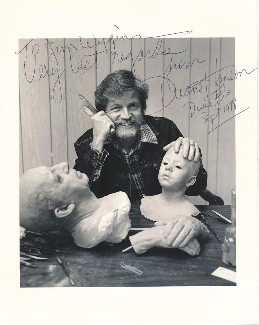 Duane Hanson- Signed Vintage Photograph (Sculptor): 8X10 Vintage B&W glossy finish photograph of Duane Hanson with two sculptures. Signed in ballpoint ink, "To Jim Wiggins- Very best regards from Duane Hanson Davie, Fla, Sept 1978." In very good condit