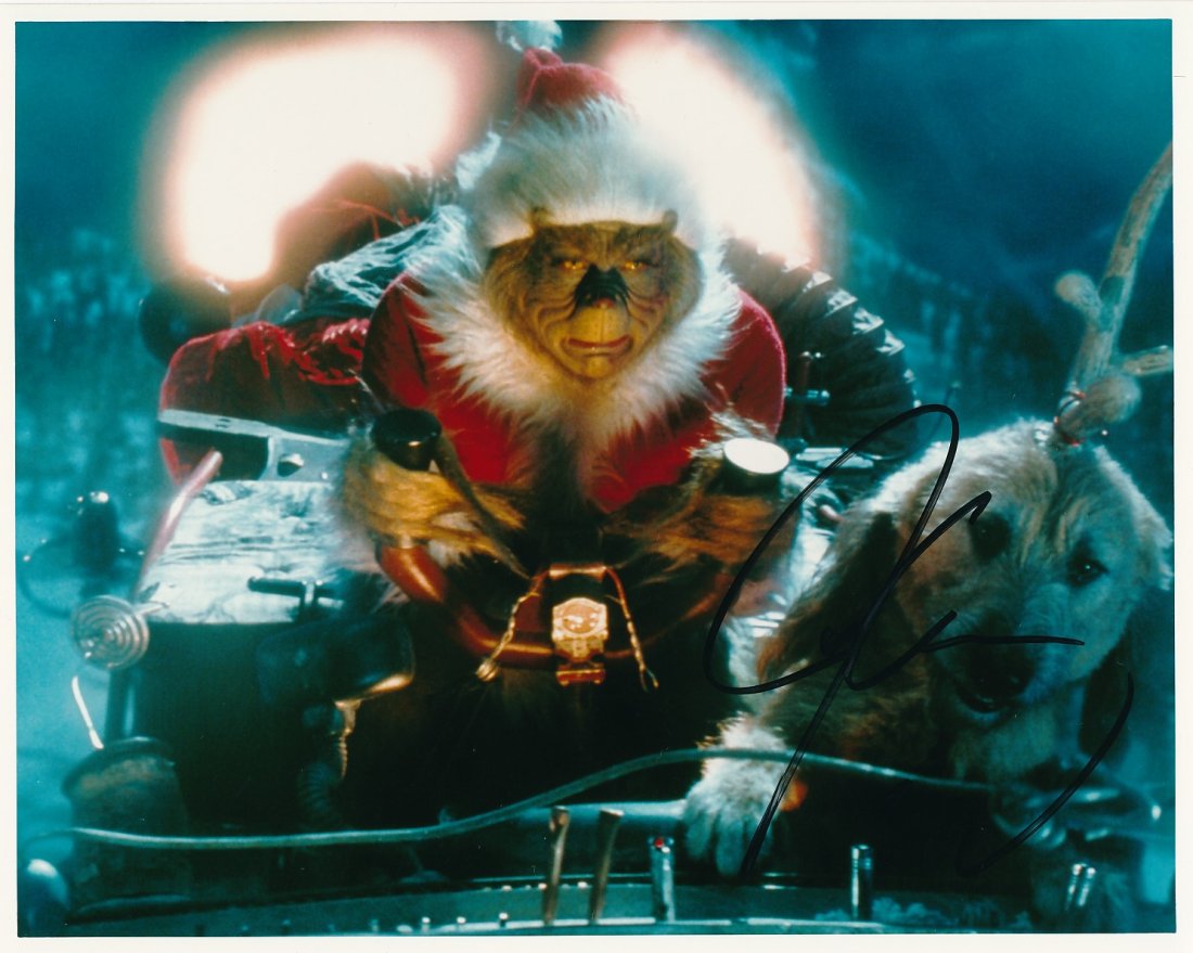 Jim Carey-Signed Photograph from "How the Grinch Stole Christmas": 10x8 Color glossy photograph from "How the Grinch Stole Christmas" signed in felt tip ink by Jim Carey. MINT condition. Comes with a full Letter of Authenticity from Todd Mueller Authentics.